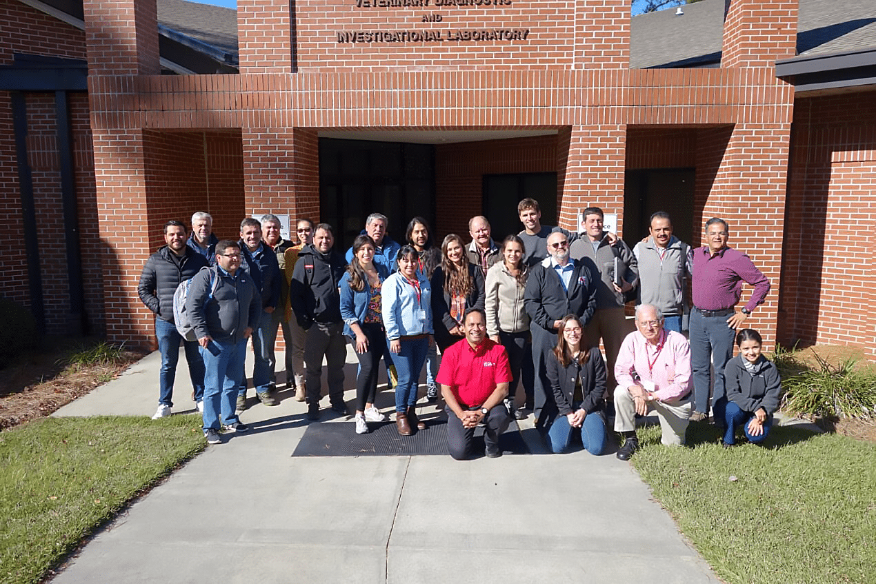 The group of attendees and involved faculty stand in front of the Tifton DLAb
