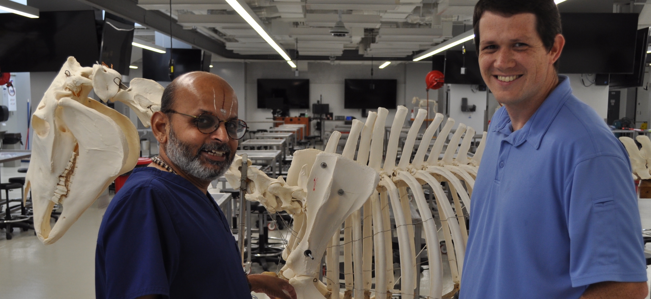Two professors with a skeleton