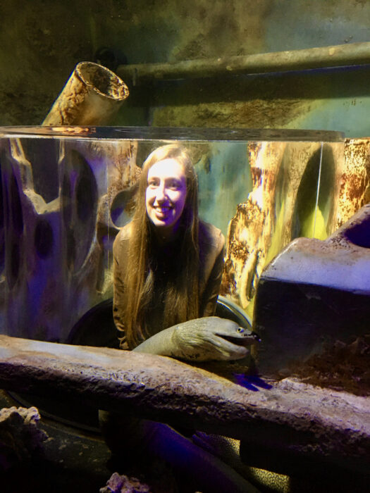 A photo of Morgan at the Georgia Aquarium with an eel